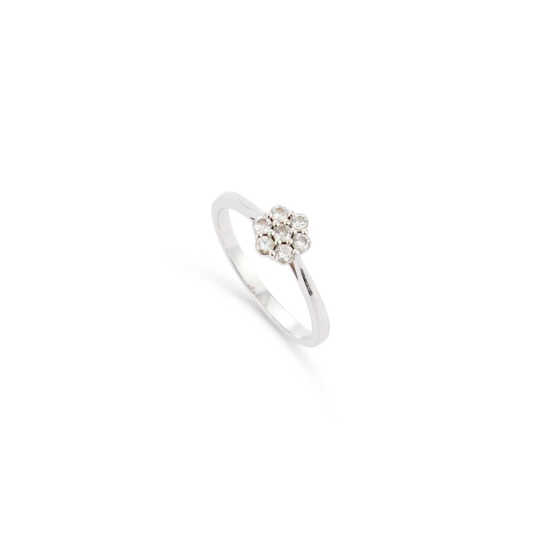 A DIAMOND CLUSTER RING: A DIAMOND CLUSTER RING round brilliant-cut diamonds in a claw setting, stamped '750'. Estimated total diamond weight 0.35 carat, ring size Q1/2, 3.1 grams Good condition. Estimated diamond colour: