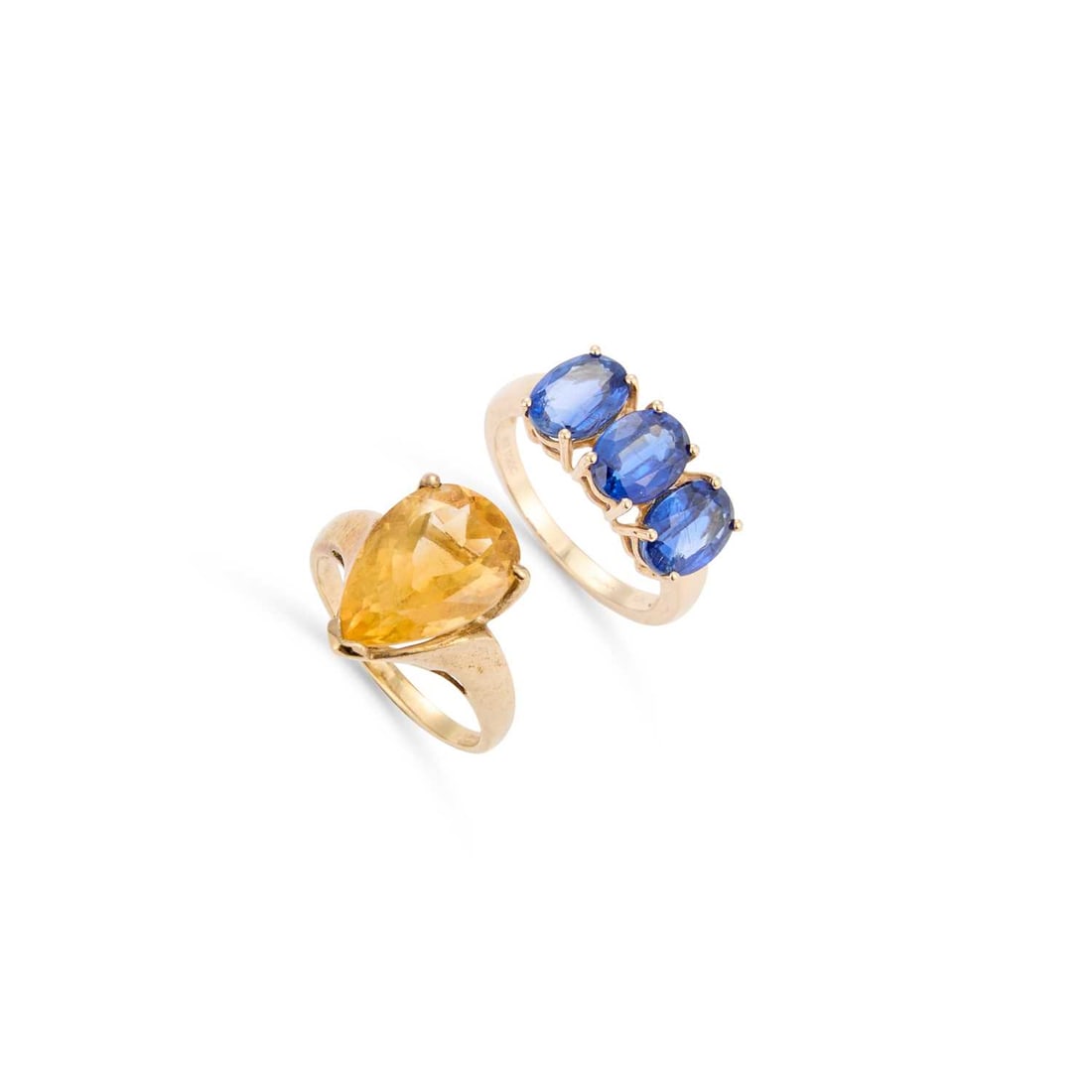 TWO 9 CARAT GOLD GEM-SET RINGS: TWO 9 CARAT GOLD GEM-SET RINGS comprising a pear-cut citrine ring, hallmarked; and a sapphire three stone ring. (2) Ring size N1/2 and N, 7.4 grams gross Good condition