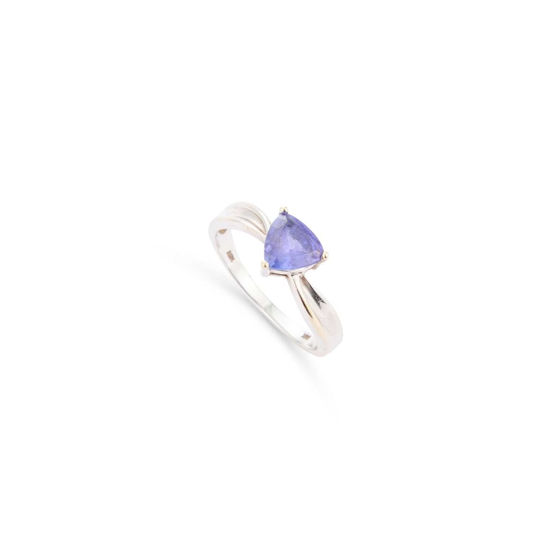 A TANZANITE RING: A TANZANITE RING a trilliant-cut tanzanite to scroll shoulders, stamped '14K'. Ring size N, 2.7 grams Good condition