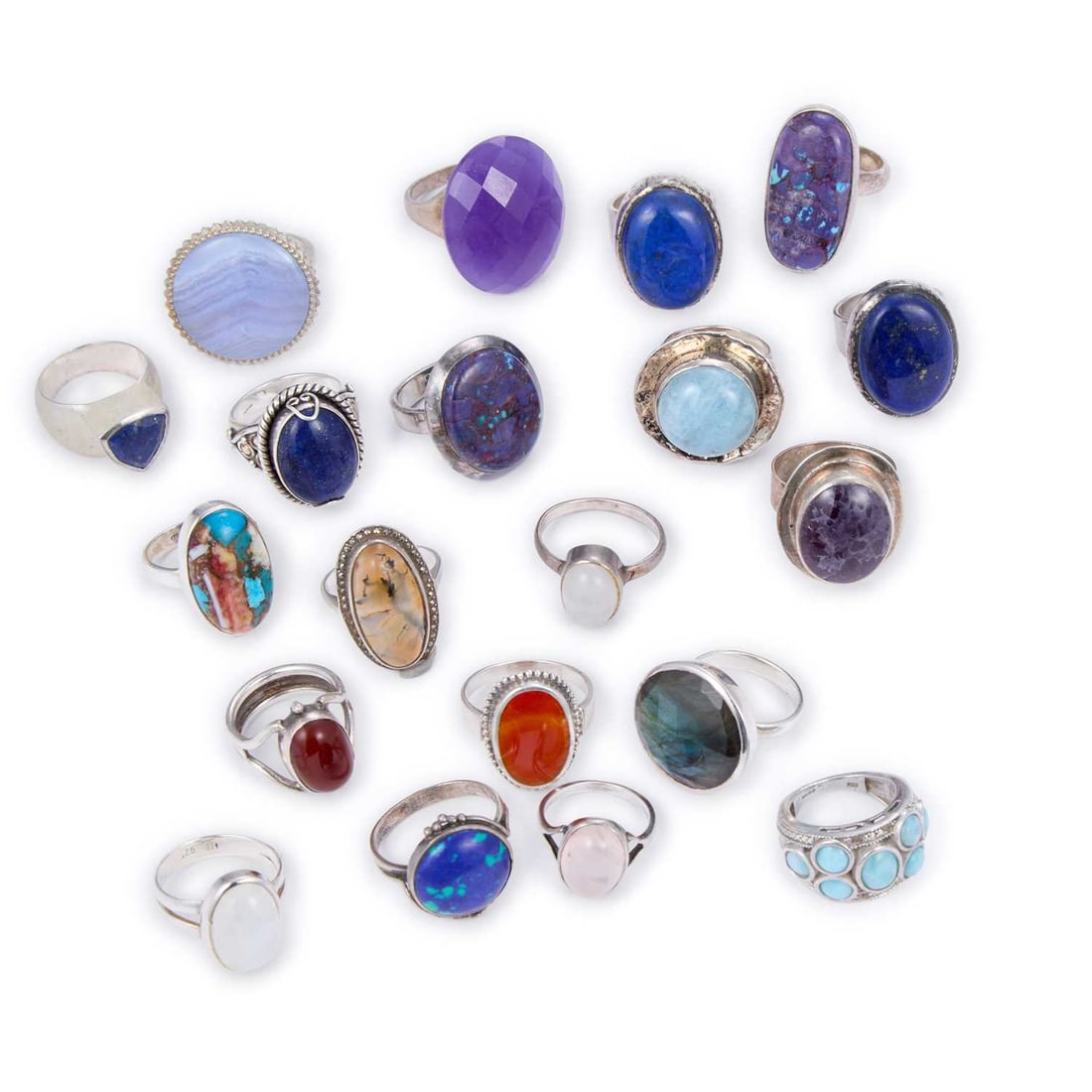 A GROUP OF GEM-SET SILVER RINGS: A GROUP OF GEM-SET SILVER RINGS including examples set with moss agate; lapis lazuli; carnelian; etc. (20) Ring size R and smaller, 174.5 grams gross