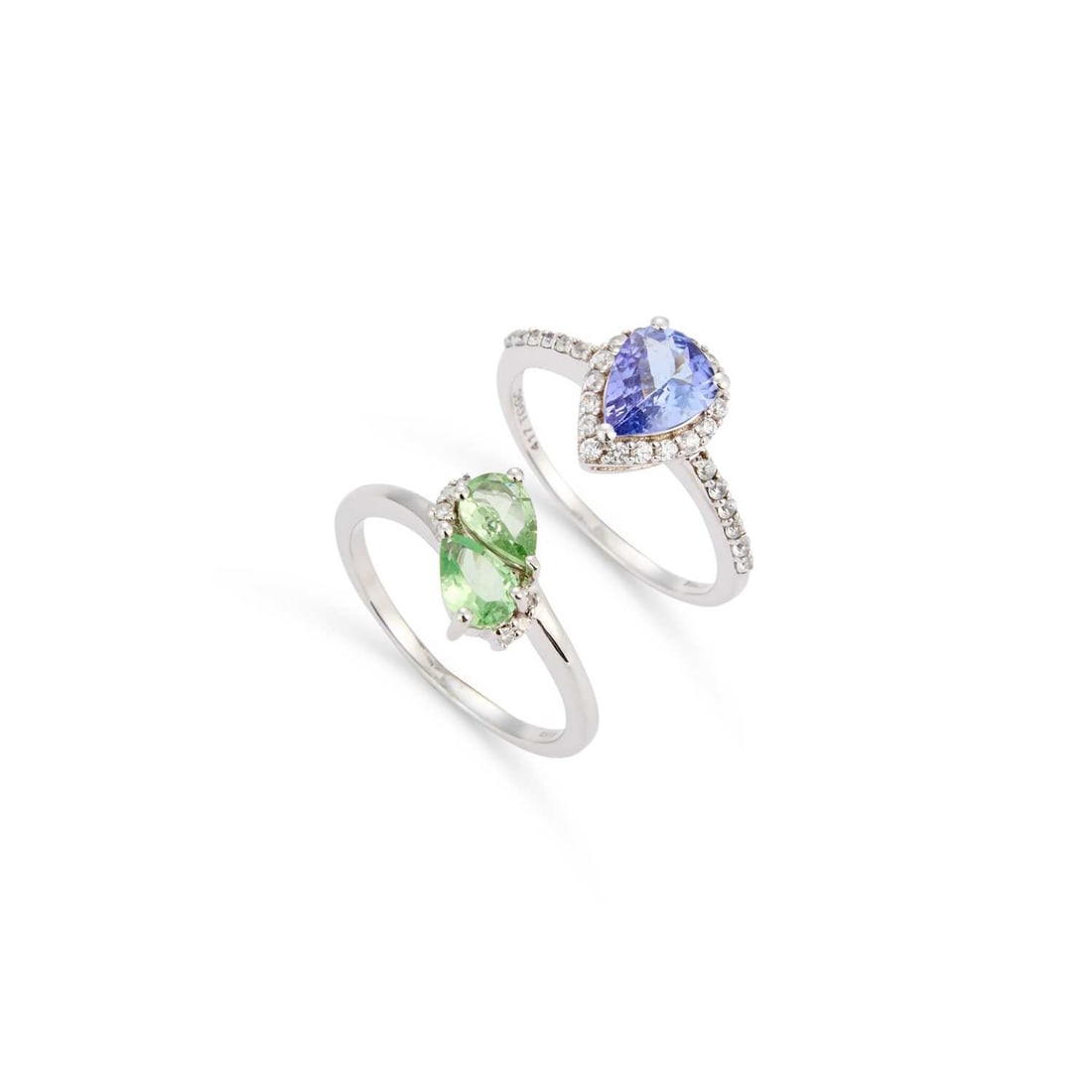 TWO 9 CARAT WHITE GOLD GEM-SET RINGS: TWO 9 CARAT WHITE GOLD GEM-SET RINGS comprising a pear-cut green spinel and diamond ring, hallmarked; and a pear-cut tanzanite and white stone cluster ring, hallmarked. (2) Ring size L1/2, 4.2 grams g
