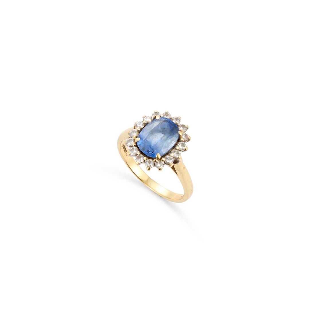 A SAPPHIRE AND DIAMOND CLUSTER RING: A SAPPHIRE AND DIAMOND CLUSTER RING an oval-cut sapphire within a border of round brilliant-cut diamonds, hallmarked London 1985. Estimated total diamond weight 0.30 carat, ring size L, 4.2 grams