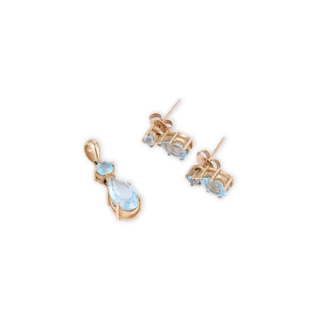 A 9 CARAT GOLD BLUE TOPAZ PENDANT AND EARRING SET: A 9 CARAT GOLD BLUE TOPAZ PENDANT AND EARRING SET featuring a pear-cut blue topaz suspended from a round-cut blue topaz, the earrings with post fittings, both hallmarked Sheffield 2000. (2) Pendant 2.