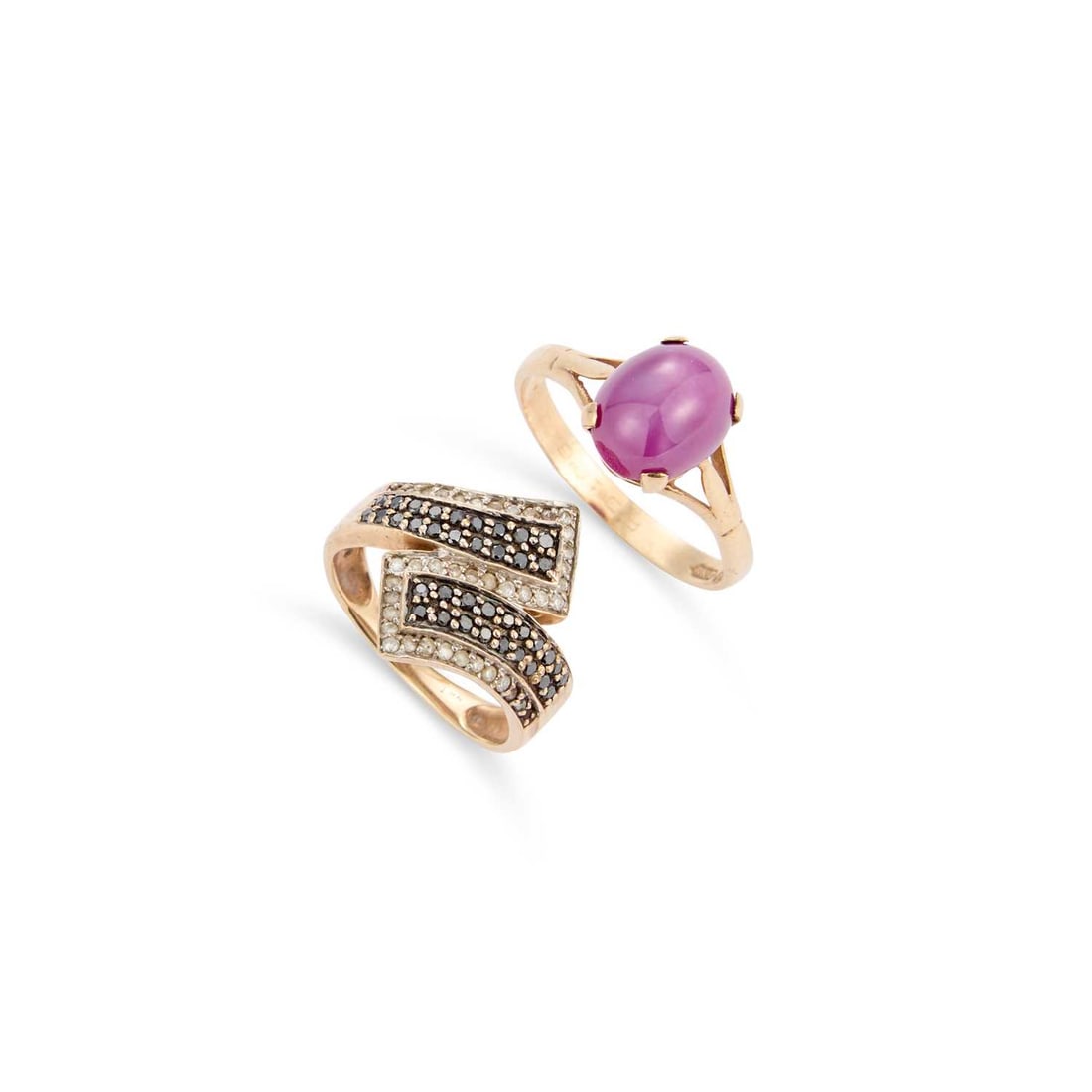 TWO 9 CARAT GOLD GEM-SET RINGS: TWO 9 CARAT GOLD GEM-SET RINGS comprising a synthetic star ruby ring, hallmarked; and a black and white diamond crossover ring, hallmarked. (2) Ring size P and I, 5 grams gross Good condition