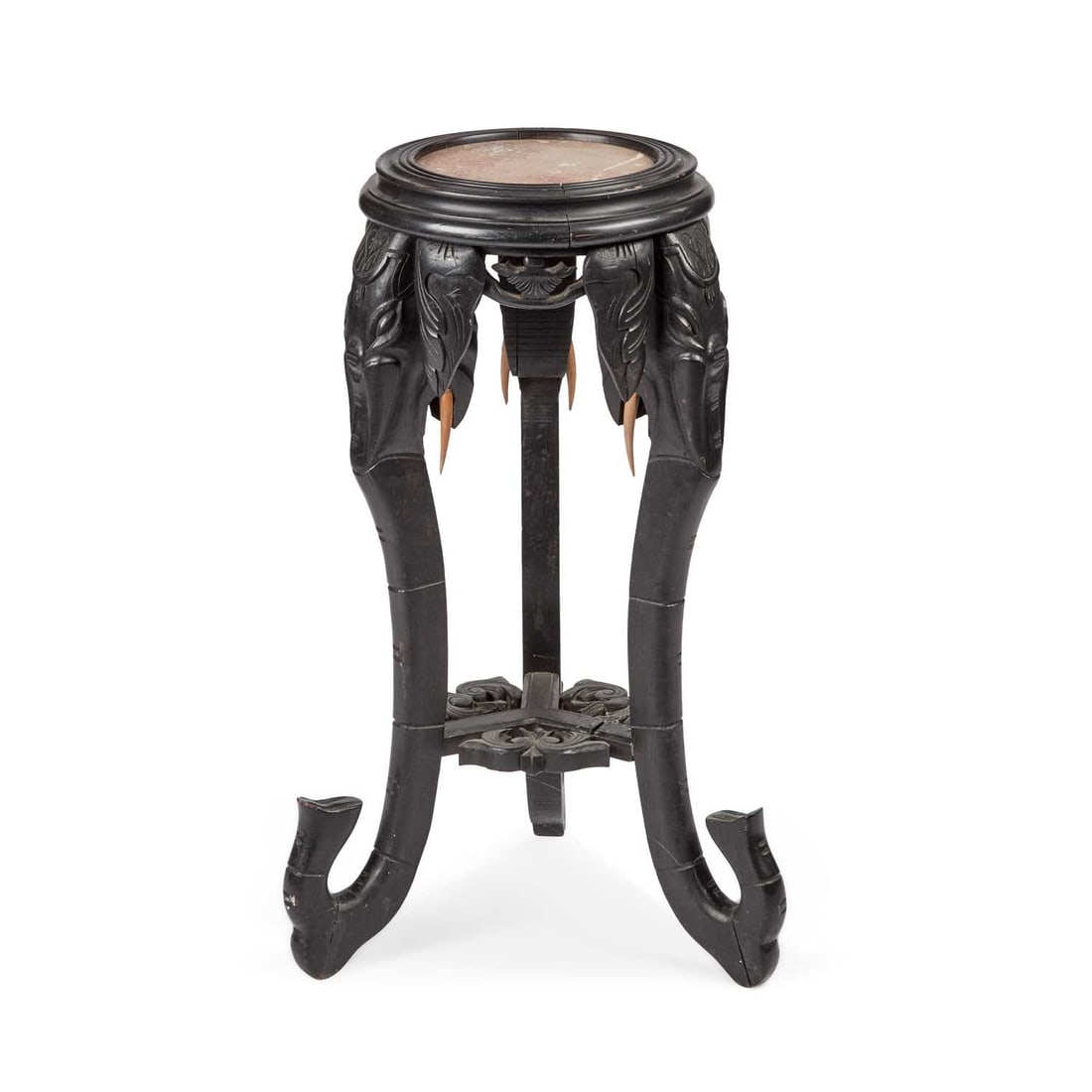 A 19TH CENTURY INDIAN MARBLE-INSET EBONISED STAND: A 19TH CENTURY INDIAN MARBLE-INSET EBONISED STAND with three elephant mask and trunk legs. 75cm high