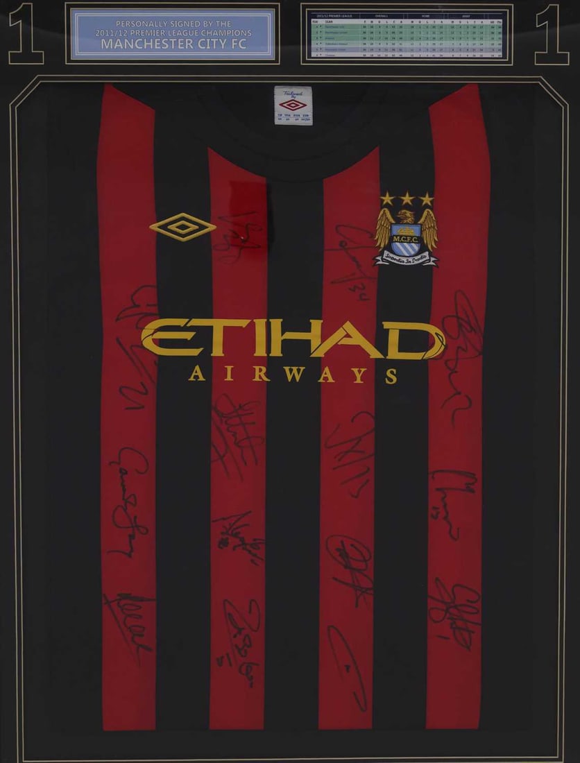 FOOTBALL MEMORABILIA: A MANCHESTER CITY MULTI SIGNED 2011 - 12 SEASON SHIRT: FOOTBALL MEMORABILIA: A MANCHESTER CITY MULTI SIGNED 2011 - 12 SEASON SHIRT by Umbro, away kit, signed in black felt pen by players and manager including; Roberto Mancini, Sergio Aguero, Nigel de