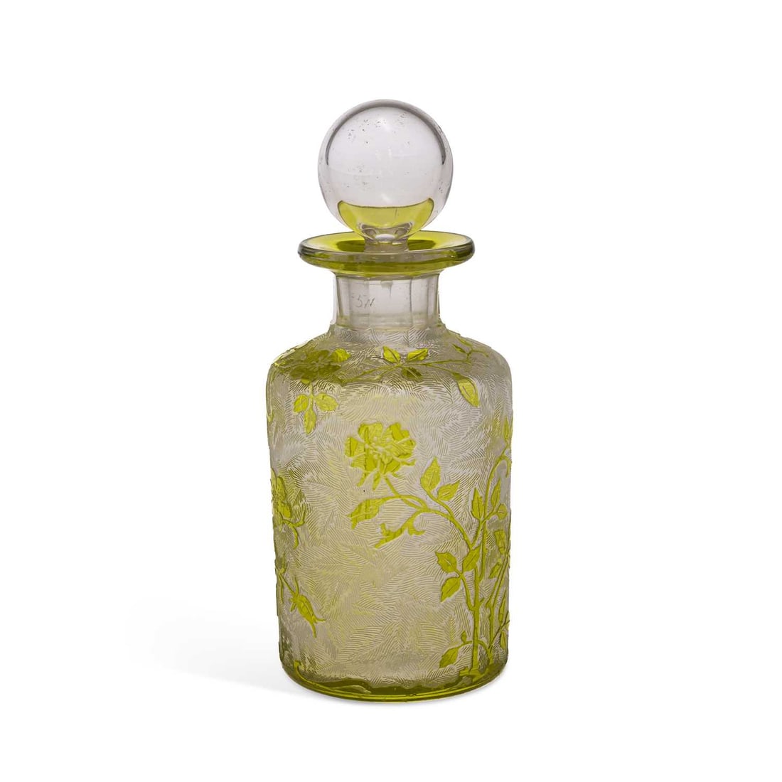 A FRENCH GLASS SCENT BOTTLE AND STOPPER CIRCA 1920: A FRENCH GLASS SCENT BOTTLE AND STOPPER CIRCA 1920 the cylindrical bottle decorated in yellow overlaid glass with flowering plants, on an acid etched dense leaf ground. 13.5cm high