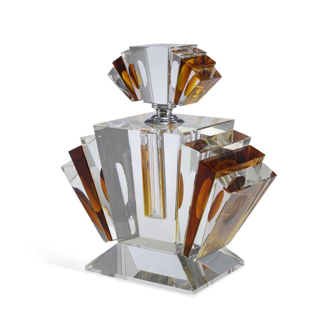 A BOHEMIAN ART DECO GLASS PERFUME BOTTLE CIRCA 1930: A BOHEMIAN ART DECO GLASS PERFUME BOTTLE CIRCA 1930 the oversized, fan shaped bottle of amber and clear glass, with a screw top. 20cm wide, 22.5cm high