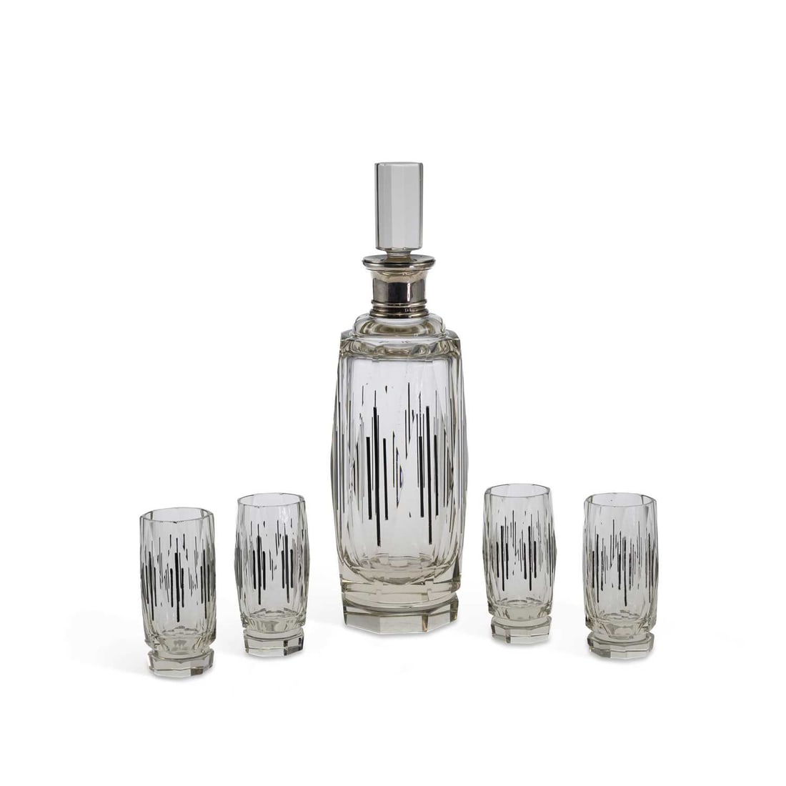 A FRENCH SILVER-COLLARED GLASS DECANTER AND GLASSES SET POSSIBLY BY BACCARAT: A FRENCH SILVER-COLLARED GLASS DECANTER AND GLASSES SET POSSIBLY BY BACCARAT of faceted form, clear glass with black geometric enamel decoration, the silver collared decanter with an elongated