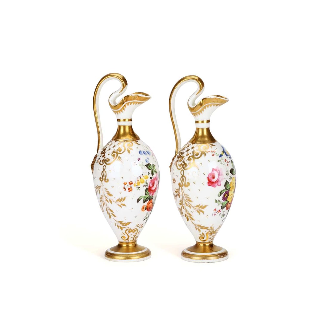 A PAIR OF ENGLISH PORCELAIN EWERS CIRCA 1820: A PAIR OF ENGLISH PORCELAIN EWERS CIRCA 1820 having ovoid bodies well painted with bouquets of flowers on a white ground, with finely gilt foliate sprays. (2) Each 15.5cm high
