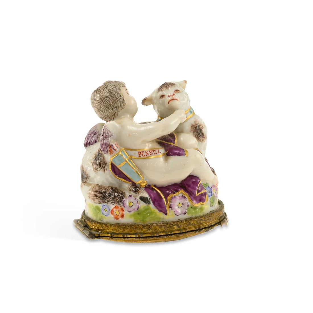 A FRENCH PORCELAIN BONBONNIÈRE CIRCA 1860: A FRENCH PORCELAIN BONBONNIÈRE CIRCA 1860 modelled as a putti with a lamb, inscribed PENSEE, gilt metal mounts. 4.5cm wide