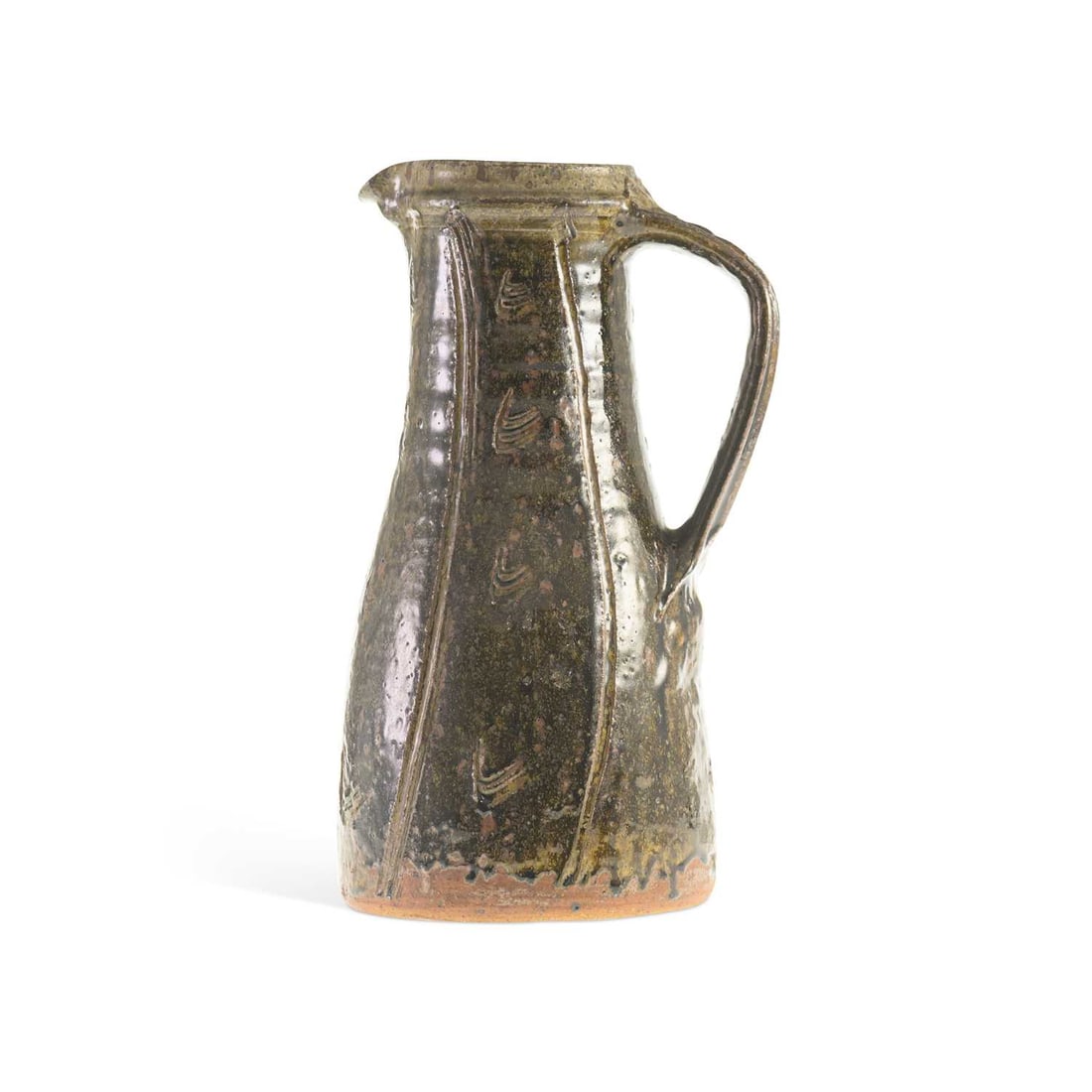 V JIM MALONE (BRITISH, B. 1946) A STONEWARE JUG: V JIM MALONE (BRITISH, B. 1946) A STONEWARE JUG of tall tapering form with a loop handle and pinched pouring lip, decorated with vertical ribs and incised motifs beneath a mottled brown and ochre glaz