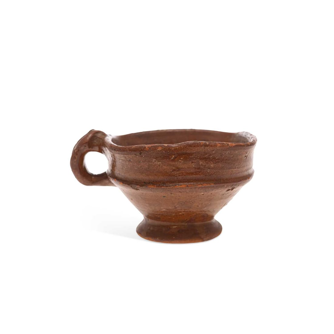 A DUTCH EARTHENWARE FIRE POT CIRCA 1700: A DUTCH EARTHENWARE FIRE POT CIRCA 1700 the squared pot having a simple loop handle and set upon a circular pedestal foot. 14cm wide