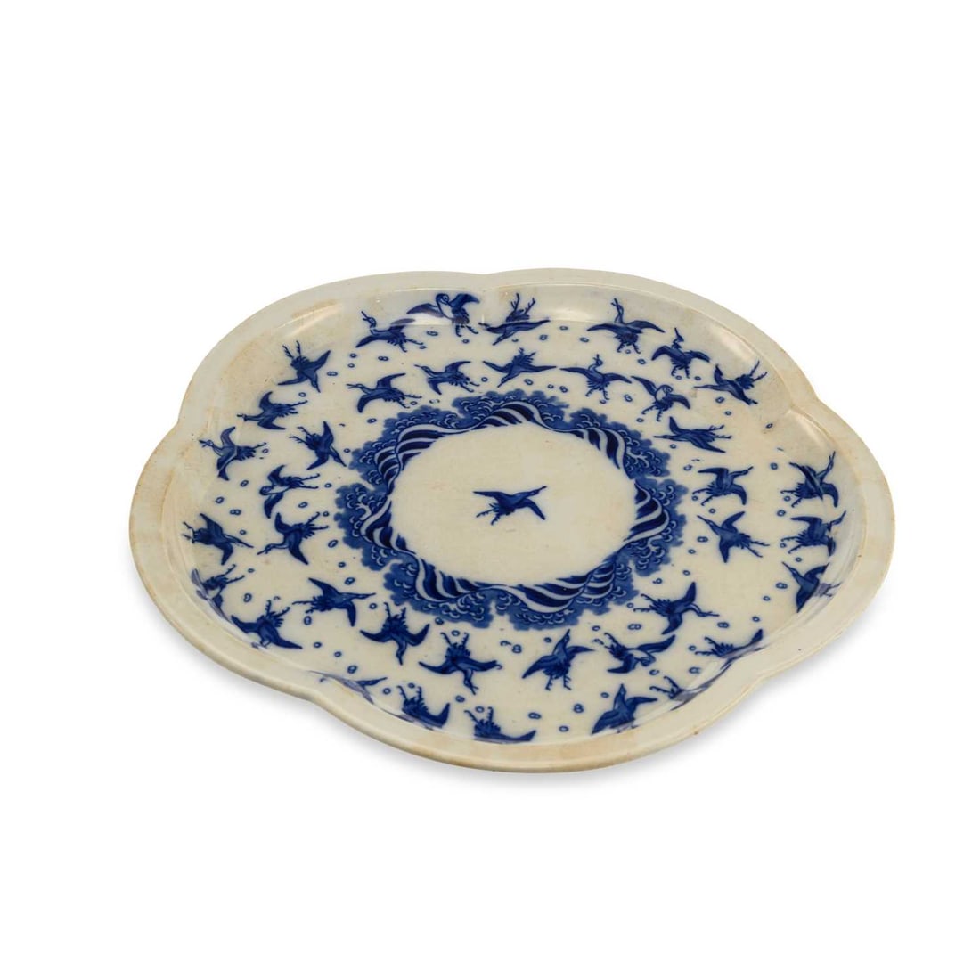 A MINTON AESTHETIC POTTERY TRAY CIRCA 1870: A MINTON AESTHETIC POTTERY TRAY CIRCA 1870 printed in underglaze blue with the Japanese Cranes pattern of numerous cranes flying above stylised waves, printed factory marks, and titled. 32cm diameter
