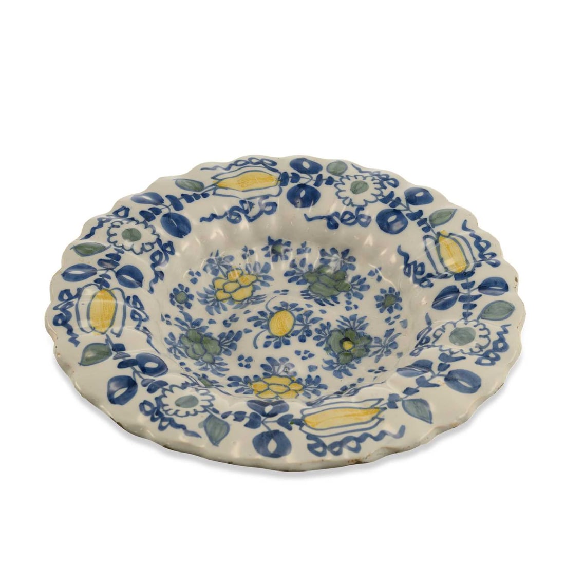 A DUTCH DELFT POLYCHROME CHARGER CIRCA 1700: A DUTCH DELFT POLYCHROME CHARGER CIRCA 1700 decorated in polychrome colours, with stylised flowering plants. 34cm diameter