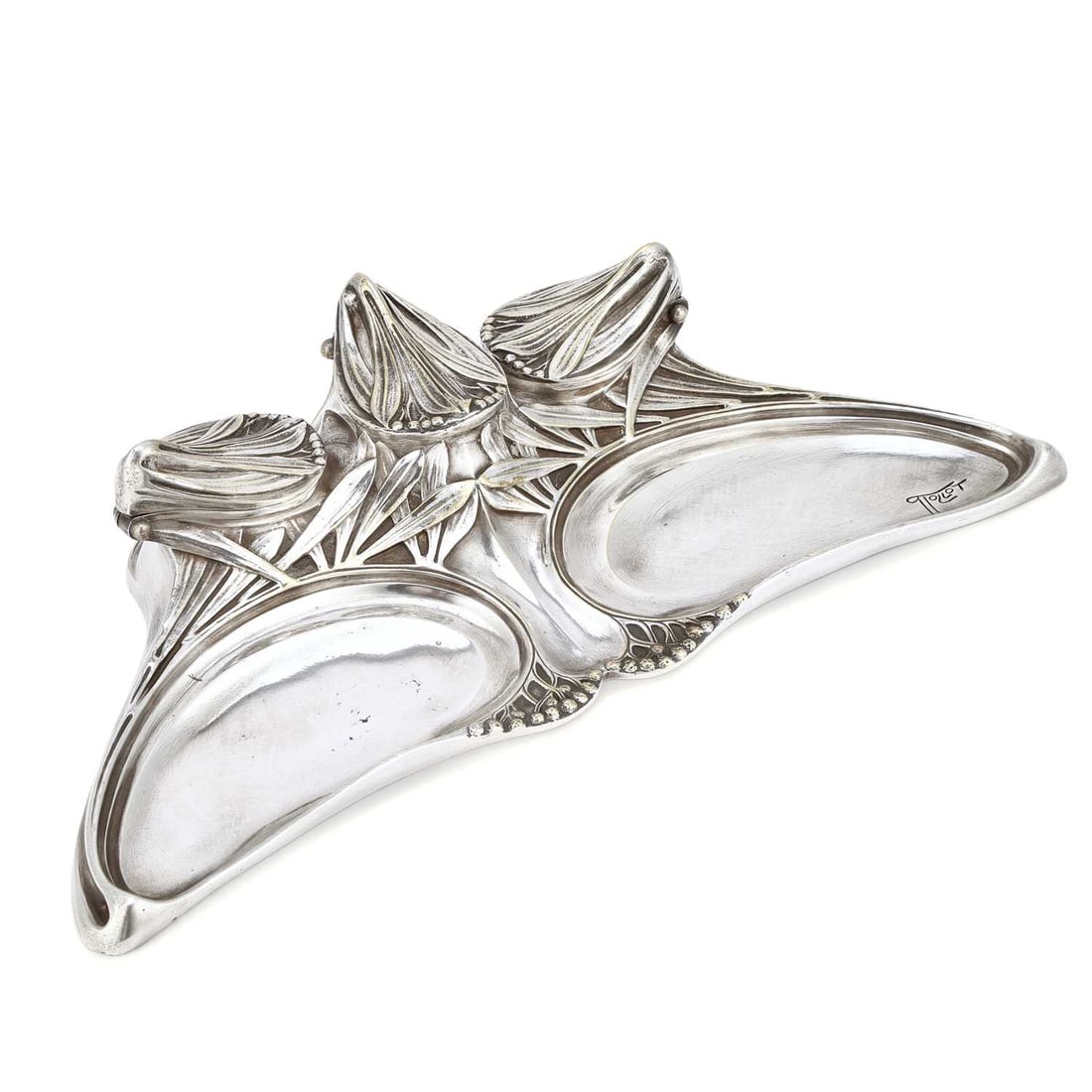 A FRENCH ART NOUVEAU SILVERED METAL FLORIFORM INKWELL CAST FROM A MODEL BY PAUL FOLLOT, CIRCA 1900: A FRENCH ART NOUVEAU SILVERED METAL FLORIFORM INKWELL CAST FROM A MODEL BY PAUL FOLLOT, CIRCA 1900 stylistically cast with blades of mistletoe leaves on three hinged covers and support, the body with 