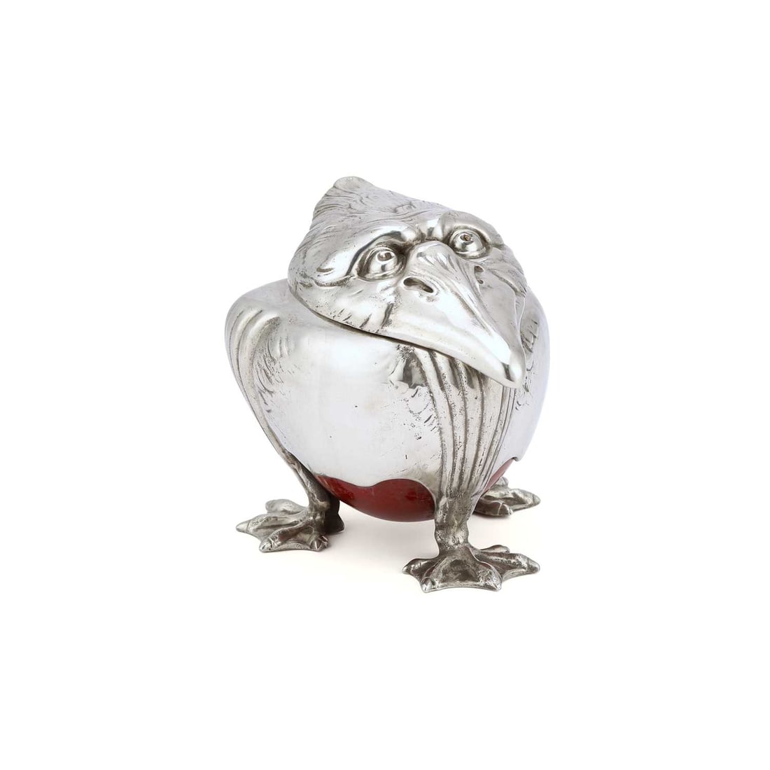 JOSEPH REINEMANN (MUNICH) A JUGENDSTIL PEWTER NOVELTY INKWELL, CIRCA 1900: JOSEPH REINEMANN (MUNICH) A JUGENDSTIL PEWTER NOVELTY INKWELL, CIRCA 1900 cast as a grotesque bird, with hinged head, ceramic liner, red base, on three webbed feet, signed JRM to one foot. 11cm