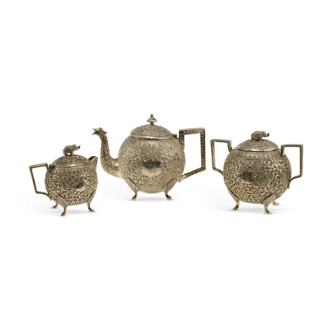 AN INDIAN SILVER KUTCH THREE-PIECE TEA SERVICE (1 of 3)