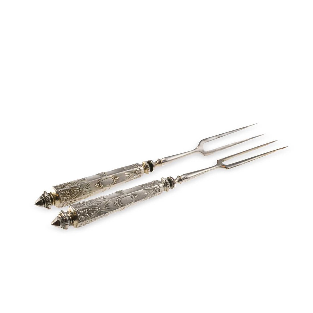 A PAIR OF CONTINENTAL SILVER HANDLED TWO-PRONGED SERVING FORKS: A PAIR OF CONTINENTAL SILVER HANDLED TWO-PRONGED SERVING FORKS possibly German, with hexagonal embossed handles, and a shaped terminal. (2) 20cm long