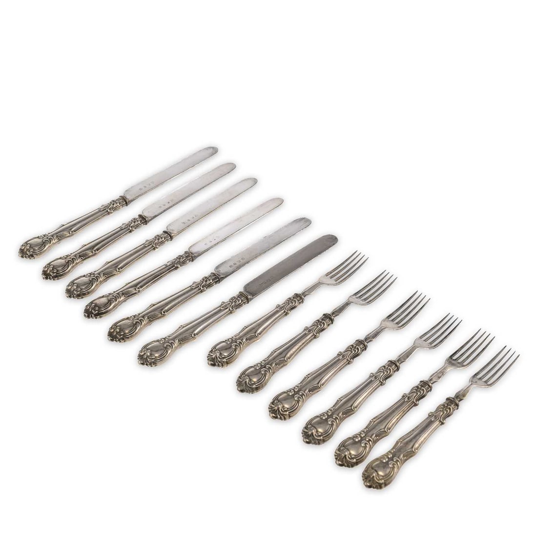 SIX PAIRS OF VICTORIAN SILVER HANDLED FRUIT KNIVES AND FORKS: SIX PAIRS OF VICTORIAN SILVER HANDLED FRUIT KNIVES AND FORKS by Charles Needham, Sheffield, lacking date letter. (12) Knives 17.5cm long