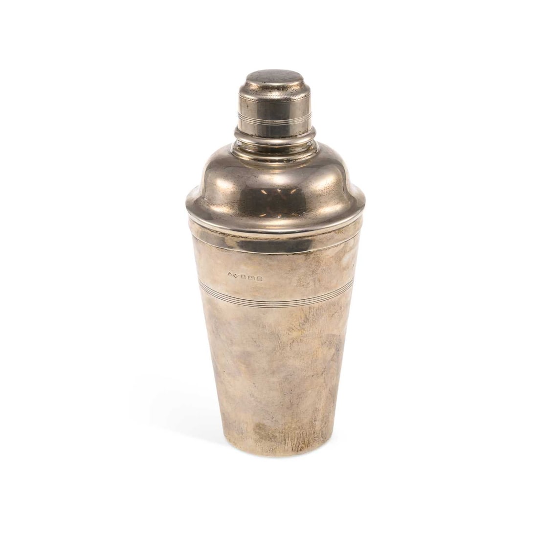 A LARGE ART DECO GEORGE V SILVER COCKTAIL SHAKER: A LARGE ART DECO GEORGE V SILVER COCKTAIL SHAKER by Henry Moreton, Birmingham 1931, of tapering cylindrical form with a removable cover, reeded decorative band. 24.5cm high, 18.9 troy ounces
