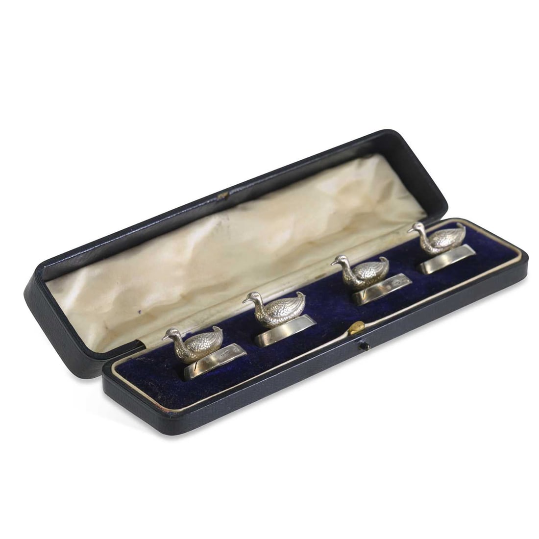 A CASED SET OF EDWARDIAN NOVELTY SILVER DUCK MENU CARD HOLDERS: A CASED SET OF EDWARDIAN NOVELTY SILVER DUCK MENU CARD HOLDERS by Sampson Mordan & Co. Ltd, Chester 1909, each of oval form with a decorative feathered duck, weighted. 3cm by 2.5cm by 2.7cm each