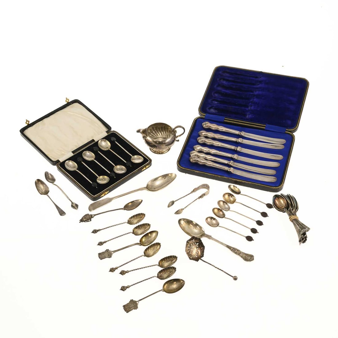 A MIXED LOT OF SILVER: A MIXED LOT OF SILVER including a Victorian silver cream jug; a cased set of coffee bean spoons; sugar tongs; etc. (Qty) Cream jug 5cm high, 16.2 troy ounces gross (excl. cased silver-handled knives)