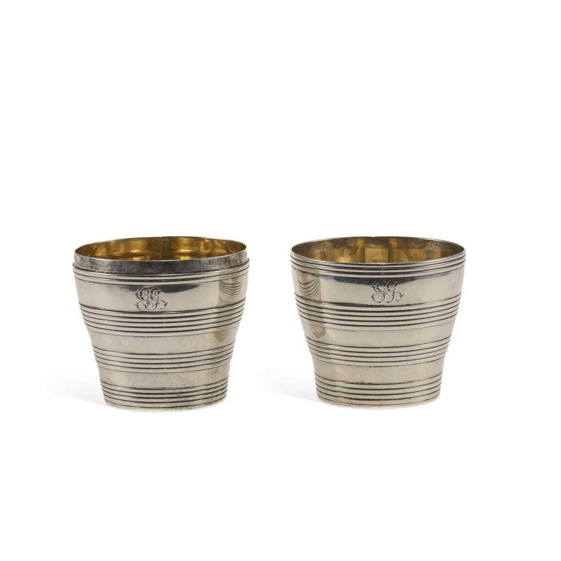 A GEORGE III SILVER DOUBLE BEAKER: A GEORGE III SILVER DOUBLE BEAKER by Charles Aldridge & Henry Green, London 1767, each of tapered form with reeded decoration, together forming a coopered barrel, with a silver-gilt interior, mono