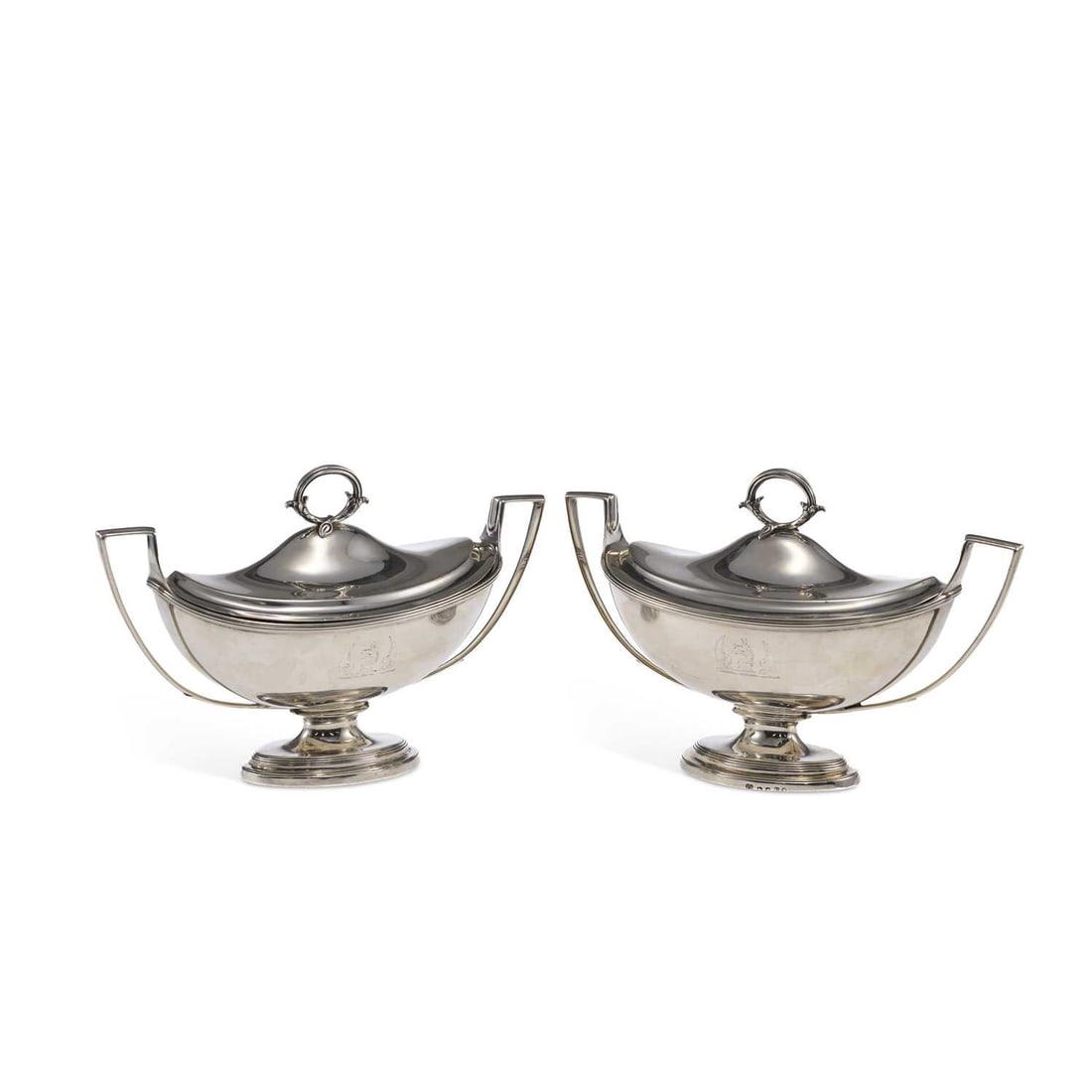 PAUL STORR: A PAIR OF GEORGE III SILVER SAUCER TUREENS: PAUL STORR: A PAIR OF GEORGE III SILVER SAUCER TUREENS London 1799, each of oval form, with reeded rims, twin-handles, a shaped leaf form loop handle to the cover, and engraved with a winged dragon's 