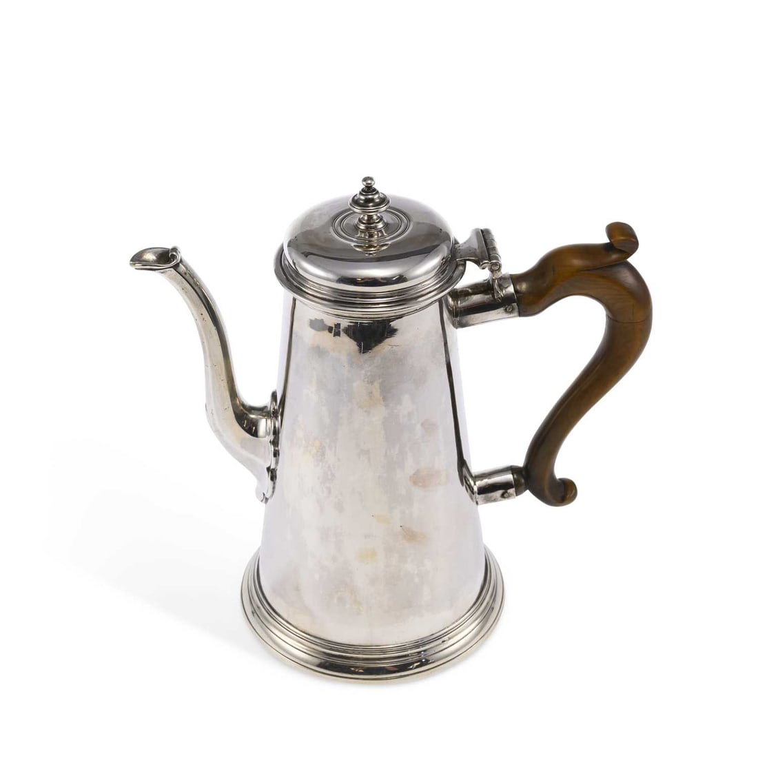 A GEORGE II SILVER COFFEE POT: A GEORGE II SILVER COFFEE POT by James Smith I or James Stone, London 1735, of tapering cylindrical form with a hinged cover, urn finial, faceted spout, on a spreading reeded foot, with a fruitwood sc