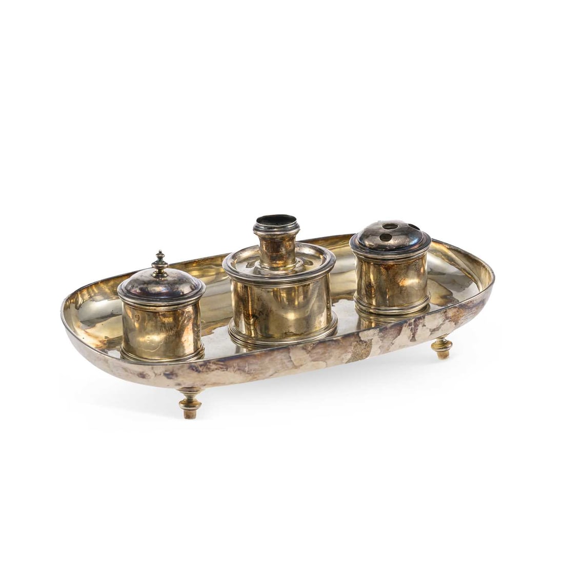 AN EARLY 18TH CENTURY BRITANNIA SILVER INKSTAND: AN EARLY 18TH CENTURY BRITANNIA SILVER INKSTAND by David Willaume I, lacking town mark and date letter, of plain oval form, fitted with an ink pot, candlestick and covered pounce pot, raised on four f