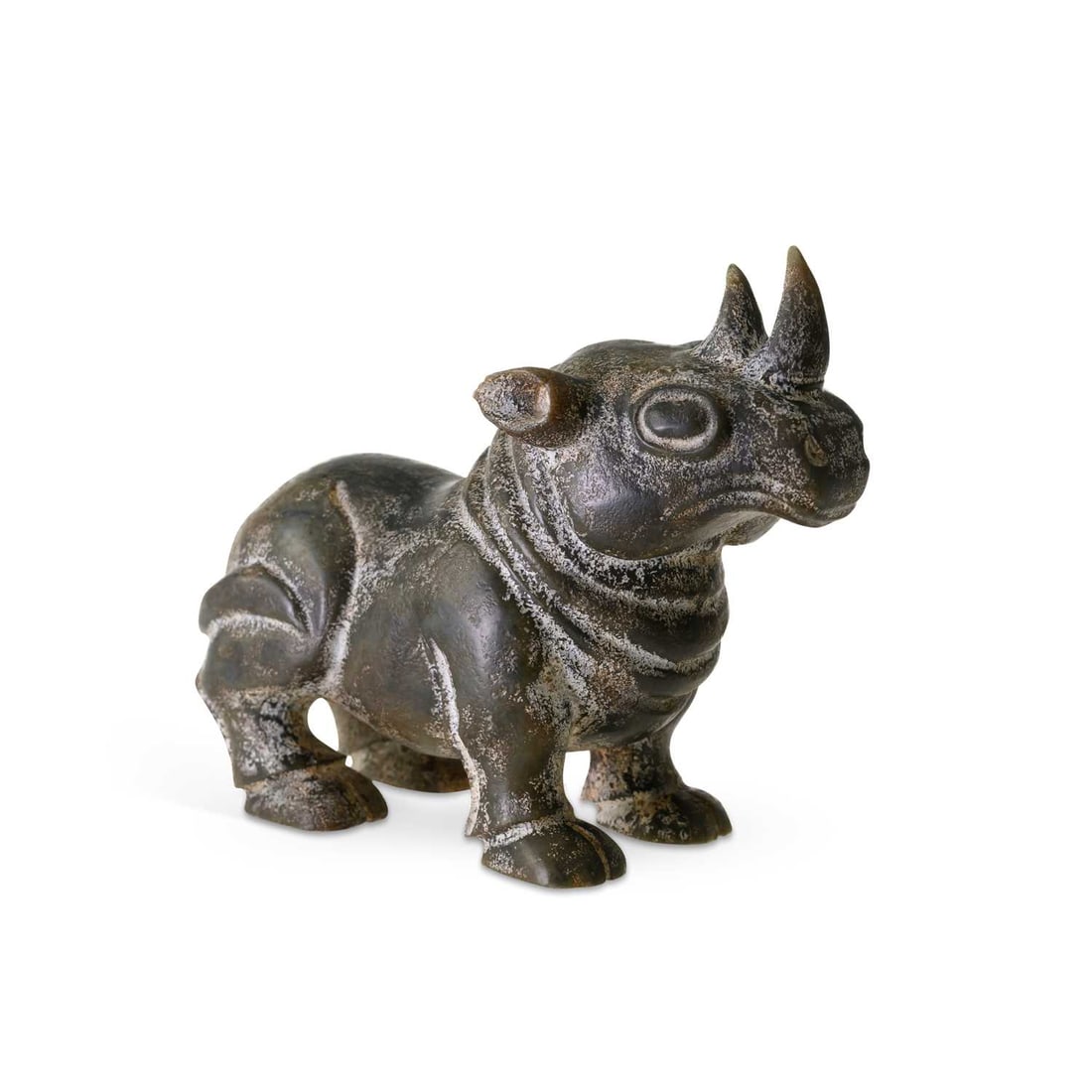 A CHINESE CARVED JADE FIGURE OF A RECUMBENT MYTHICAL BEAST: A CHINESE CARVED JADE FIGURE OF A RECUMBENT MYTHICAL BEAST modelled with twin horns, prominent eyes and folded legs. 14cm high