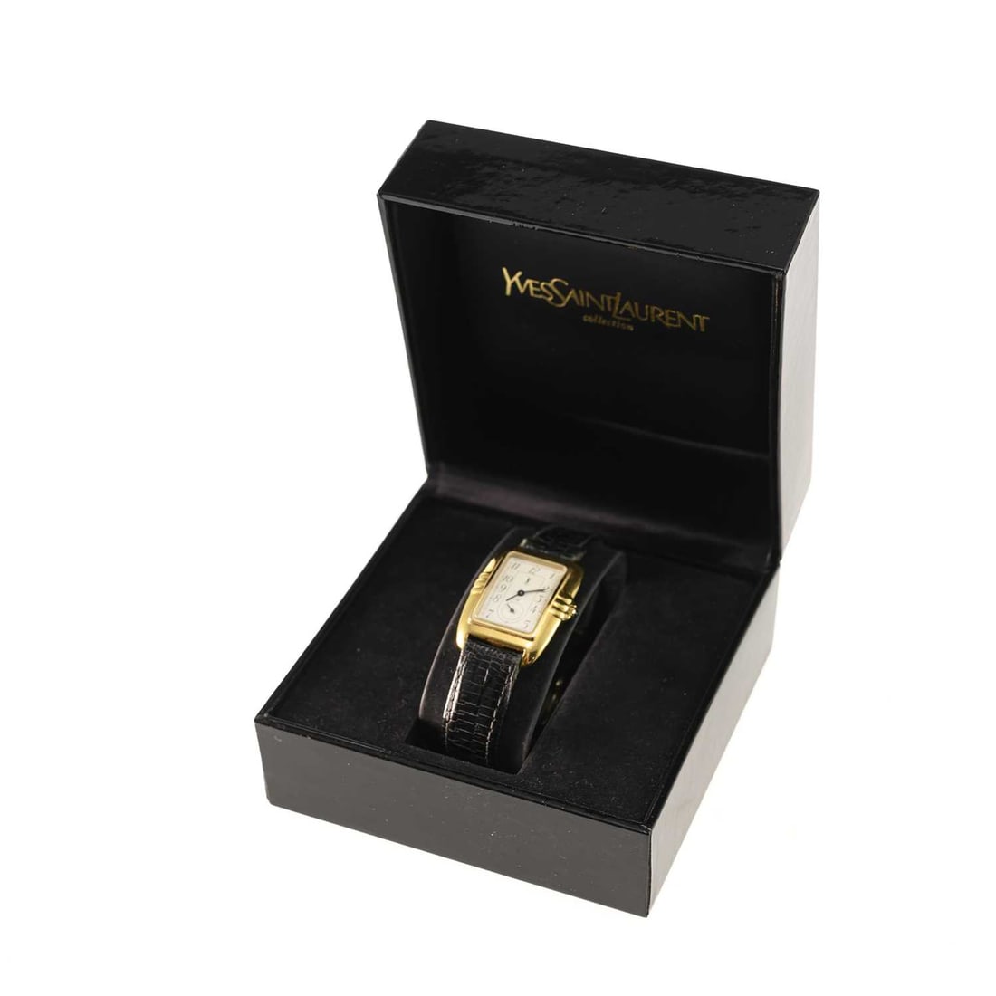 A LADY'S GOLD PLATED YVES SAINT LAURENT STRAP WATCH: A LADY'S GOLD PLATED YVES SAINT LAURENT STRAP WATCH the rectangular white dial signed YSL, with Arabic numerals and outer minute track, sub-seconds dial at the 6 o'clock position, black hands,