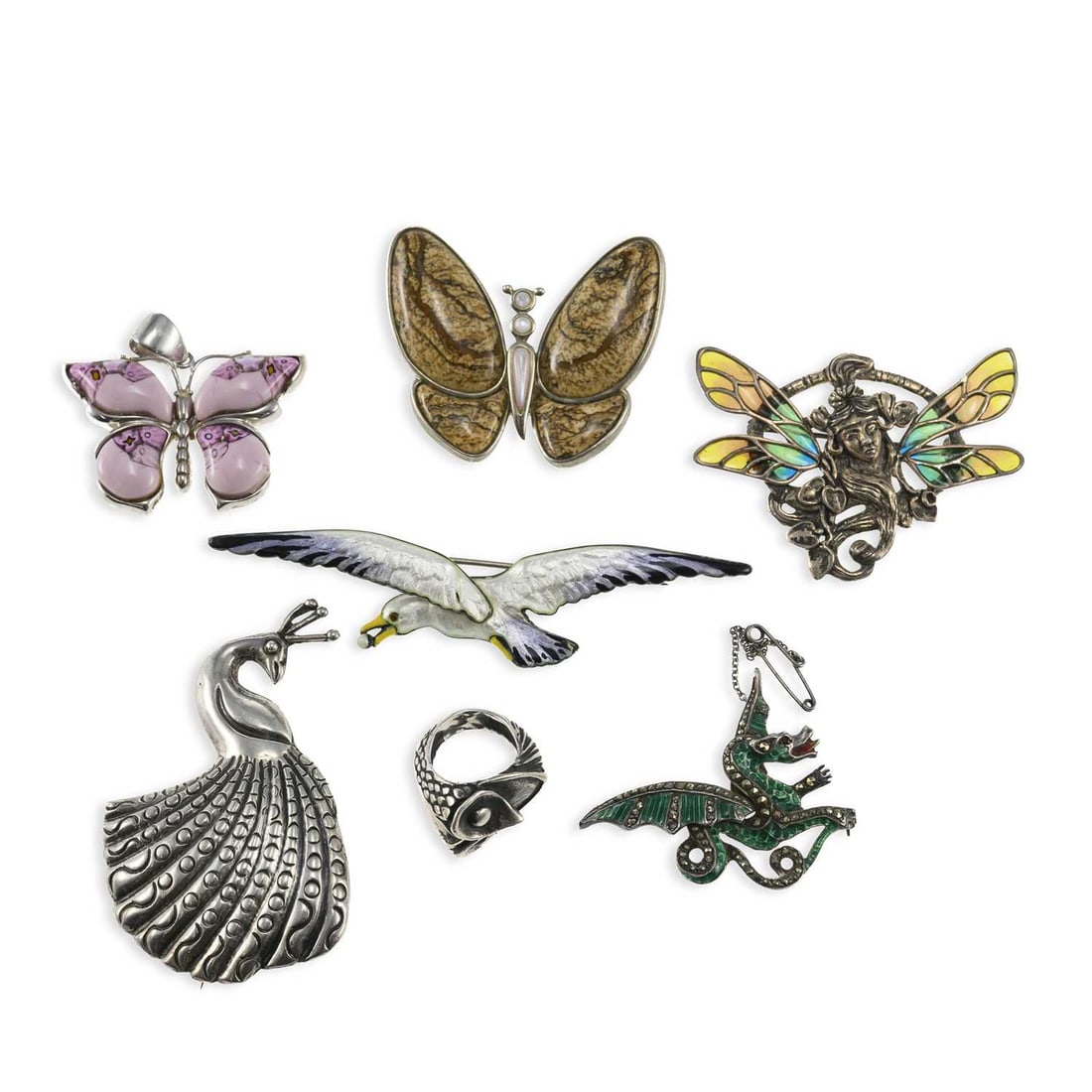 A COLLECTION OF SILVER JEWELLERY: A COLLECTION OF SILVER JEWELLERY including a Norwegian silver and enamel gull brooch by Marius Hammer, stamped marks; a Mexican peacock brooch, stamped marks; a green enamel and marcasite dragon brooc