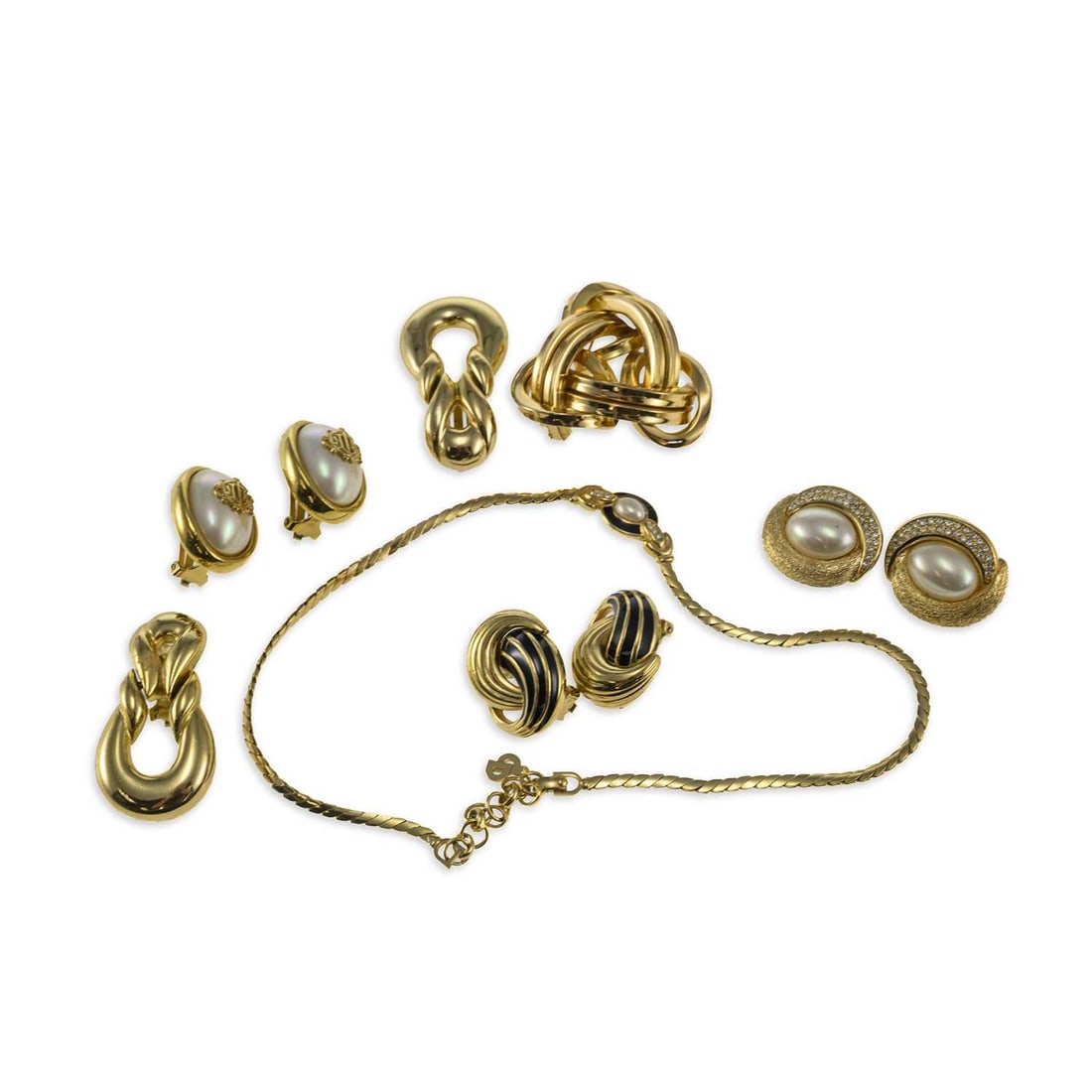A GROUP OF CHRISTIAN DIOR COSTUME JEWELLERY: A GROUP OF CHRISTIAN DIOR COSTUME JEWELLERY comprising a brooch of entwined triangular design, stamp marked 'Chr. Dior 1968 Germany'; two pairs of faux pearl clip on earrings, stamped marks; a pair of