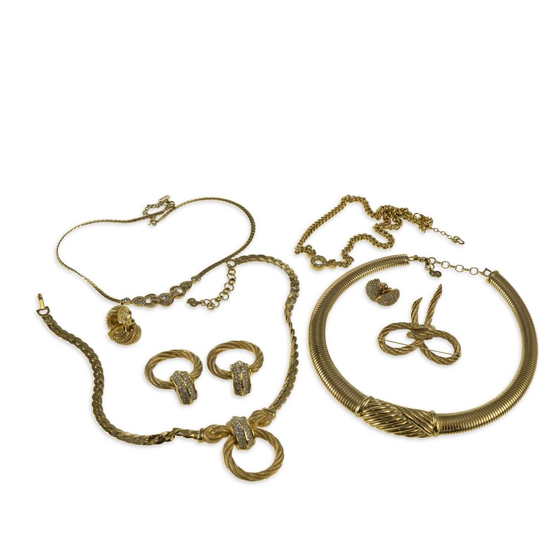 A GROUP OF CHRISTIAN DIOR COSTUME JEWELLERY: A GROUP OF CHRISTIAN DIOR COSTUME JEWELLERY including a collar necklace; a pair of rhinestone clip-on earrings, stamped marks; a rhinestone static pendant necklace; a rhinestone pendant curb link chai