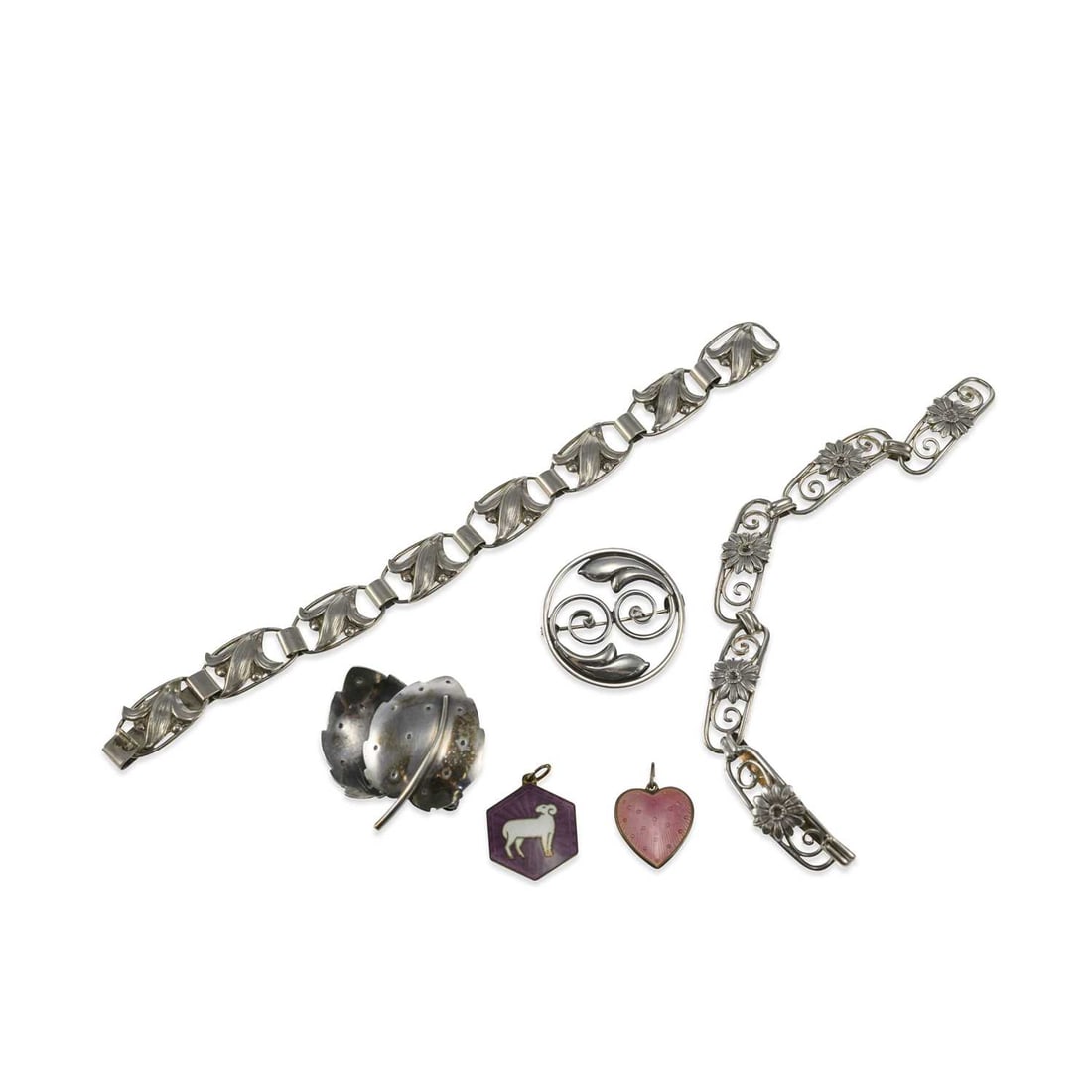 A GROUP OF SCANDINAVIAN SILVER JEWELLERY: A GROUP OF SCANDINAVIAN SILVER JEWELLERY including a Norwegian silver-gilt and enamel Aries Zodiac pendant by David Andersen; a Swedish double leaf brooch, by Stilsmycken Per Ericsson; etc. (6) First