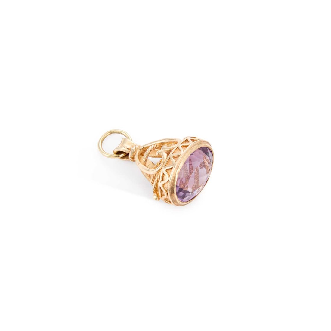 A 9 CARAT GOLD AMETHYST FOB PENDANT: A 9 CARAT GOLD AMETHYST FOB PENDANT an oval-cut amethyst within a fancy mount, hallmarked Birmingham 1972. 3cm long, 8 grams Good condition