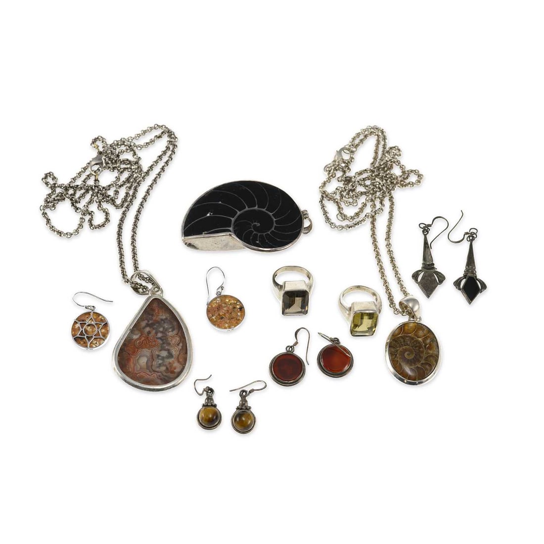 A GROUP OF GEM-SET JEWELLERY: A GROUP OF GEM-SET JEWELLERY including a smoky quartz ring, stamped '925'; a pair of carnelian earrings, shepherds hook fittings; a pair of tiger's eye drop earrings; etc. (9) First ring size N1/2, 15