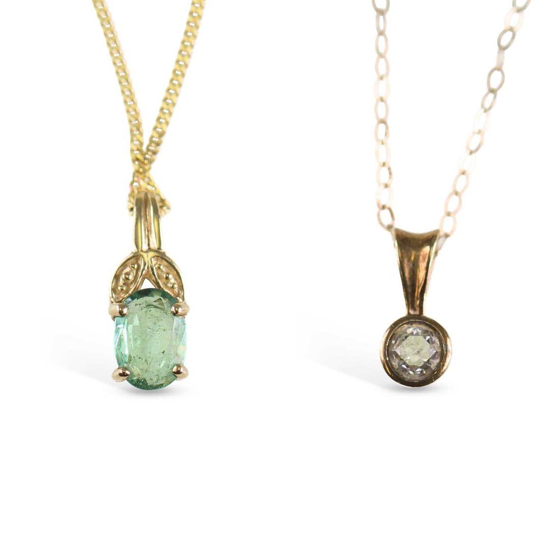 TWO 9 CARAT GOLD GEM-SET PENDANT NECKLACES: TWO 9 CARAT GOLD GEM-SET PENDANT NECKLACES comprising a round brilliant-cut diamond solitaire pendant, on a fine chain; and an oval-cut emerald pendant, on a fine chain, hallmarked. (2) First stated d