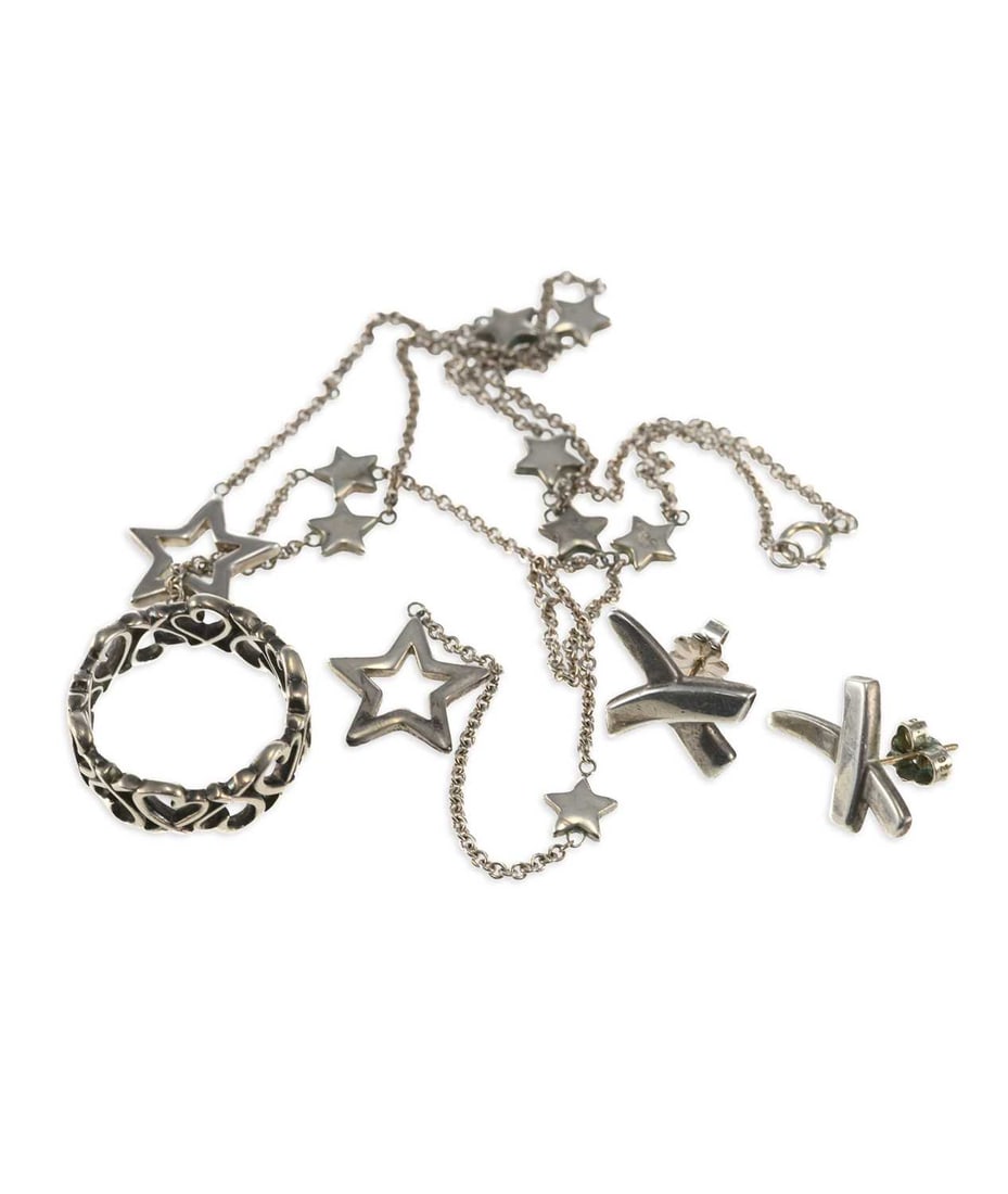 A GROUP OF TIFFANY & CO SILVER JEWELLERY: A GROUP OF TIFFANY & CO SILVER JEWELLERY comprising a pair of Paloma Picasso Graffiti X stud earrings, stamped '925'; a star station lariat necklace, hallmarked; a Paloma Picasso 'Loving Hearts' ring,