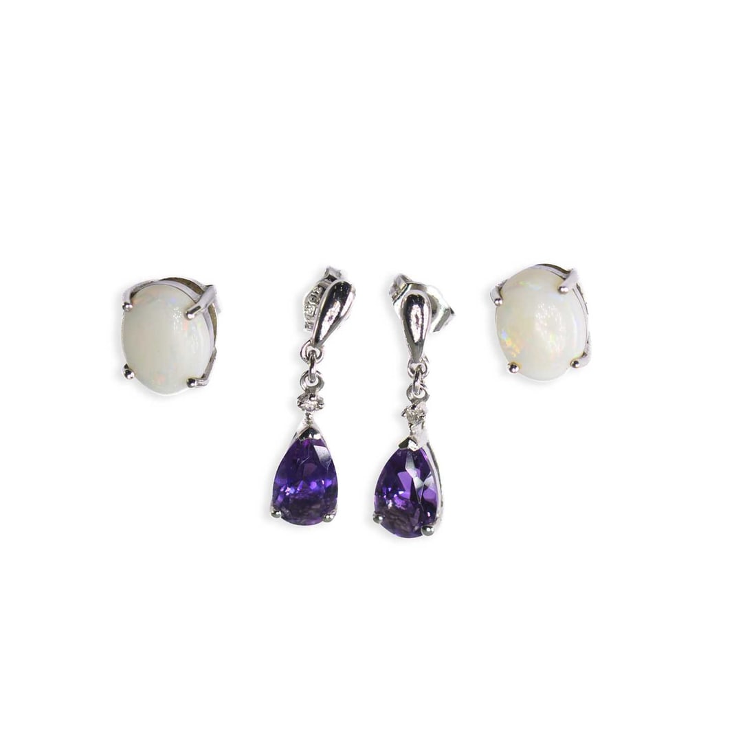 TWO PAIRS OF 9 CARAT WHITE GOLD GEM-SET EARRINGS: TWO PAIRS OF 9 CARAT WHITE GOLD GEM-SET EARRINGS comprising a pair of oval opal stud earrings, hallmarked; and a pair of amethyst and diamond pendant earrings, with post fittings, hallmarked. (2) 2cm 