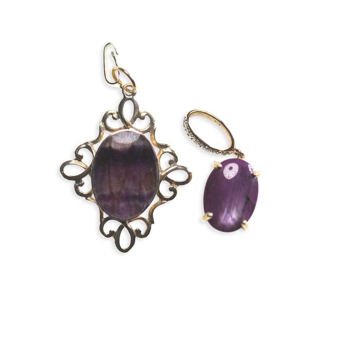 TWO 9 CARAT GOLD GEM-SET PENDANTS: TWO 9 CARAT GOLD GEM-SET PENDANTS comprising a blue john pendant, hallmarked; and a star ruby pendant, hallmarked. (2) 4cm long, 7.4 grams gross Good condition