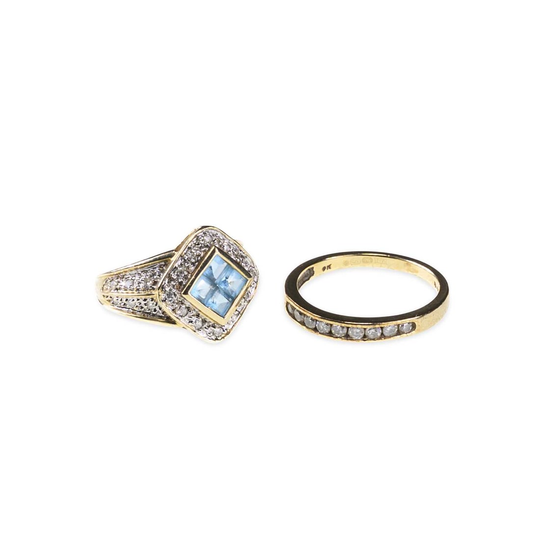 TWO 9 CARAT GOLD GEM-SET RINGS: TWO 9 CARAT GOLD GEM-SET RINGS comprising a blue topaz and diamond cluster ring, hallmarked; and a diamond half hoop ring, hallmarked. (2) Second stated diamond weight 0.25 carat, ring sizes J1/2 and
