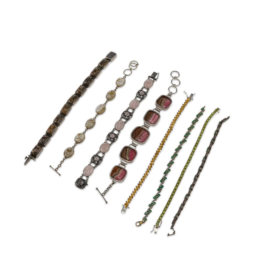 A GROUP OF GEM-SET BRACELETS: A GROUP OF GEM-SET BRACELETS including a rose quartz panel bracelet, hallmarked; another set with rutilated quartz; etc. (8) First 20cm long, 210 grams gross