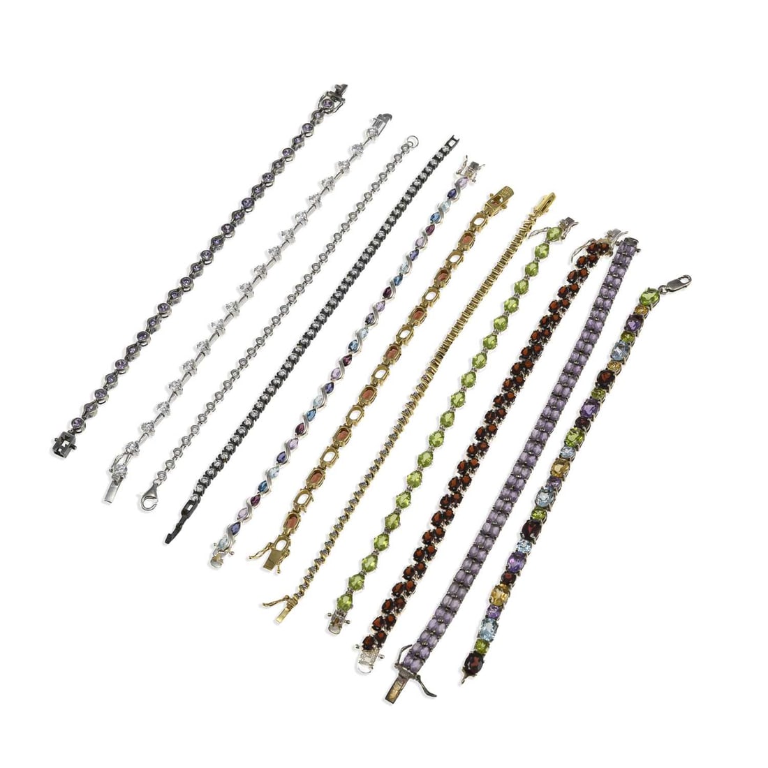 A GROUP OF GEM-SET BRACELETS: A GROUP OF GEM-SET BRACELETS including a double row example set with pear-cut garnets; an oval-cut peridot line bracelet; etc. (11) First 20cm long, 152.9 grams gross