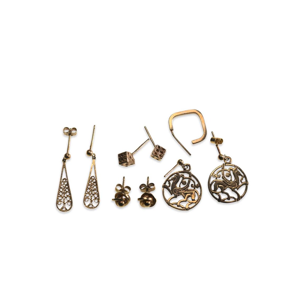 A GROUP OF GOLD EARRINGS: A GROUP OF GOLD EARRINGS including a pair of 9 carat gold gryphon pendant earrings; a pair of 9 carat gold filigree pendant earrings; a pair of 9 carat gold dice stud earrings; a pair of knot stud ear