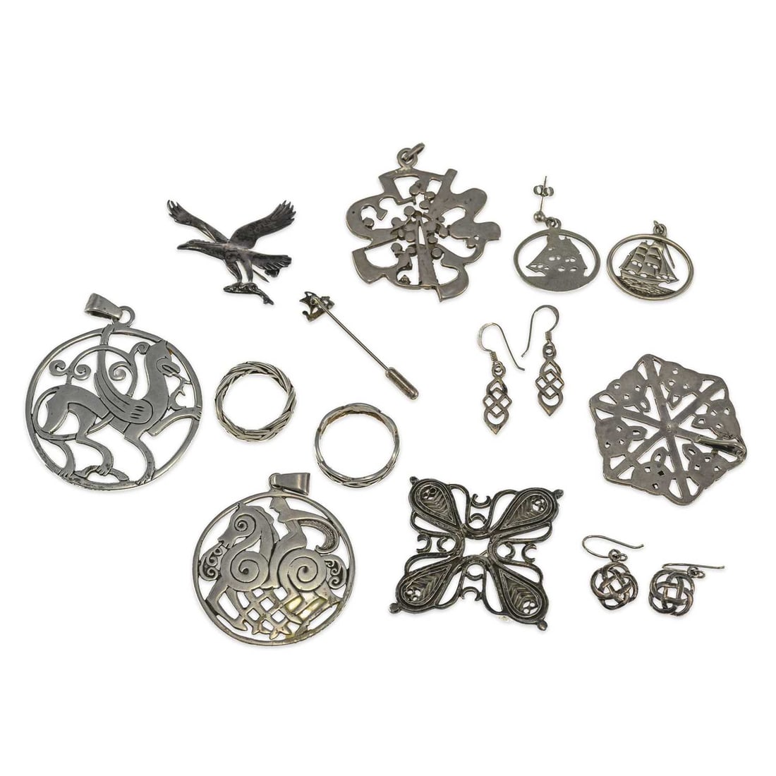 A GROUP OF CELTIC AND SCOTTISH SILVER JEWELLERY: A GROUP OF CELTIC AND SCOTTISH SILVER JEWELLERY including an Ola Gorie sea eagle brooch, in flight holding a fish; an Ola Gorie abstract modernist pendant; etc. (12) First 3.2cm wide, 81.6 grams gross
