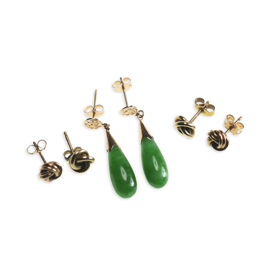 THREE PAIRS OF EARRINGS: THREE PAIRS OF EARRINGS comprising a pair of jade pendant earrings, with post fittings; and two pairs of knot earrings, with post fittings. (3) 3cm long and smaller, 6.7 grams gross Good condition