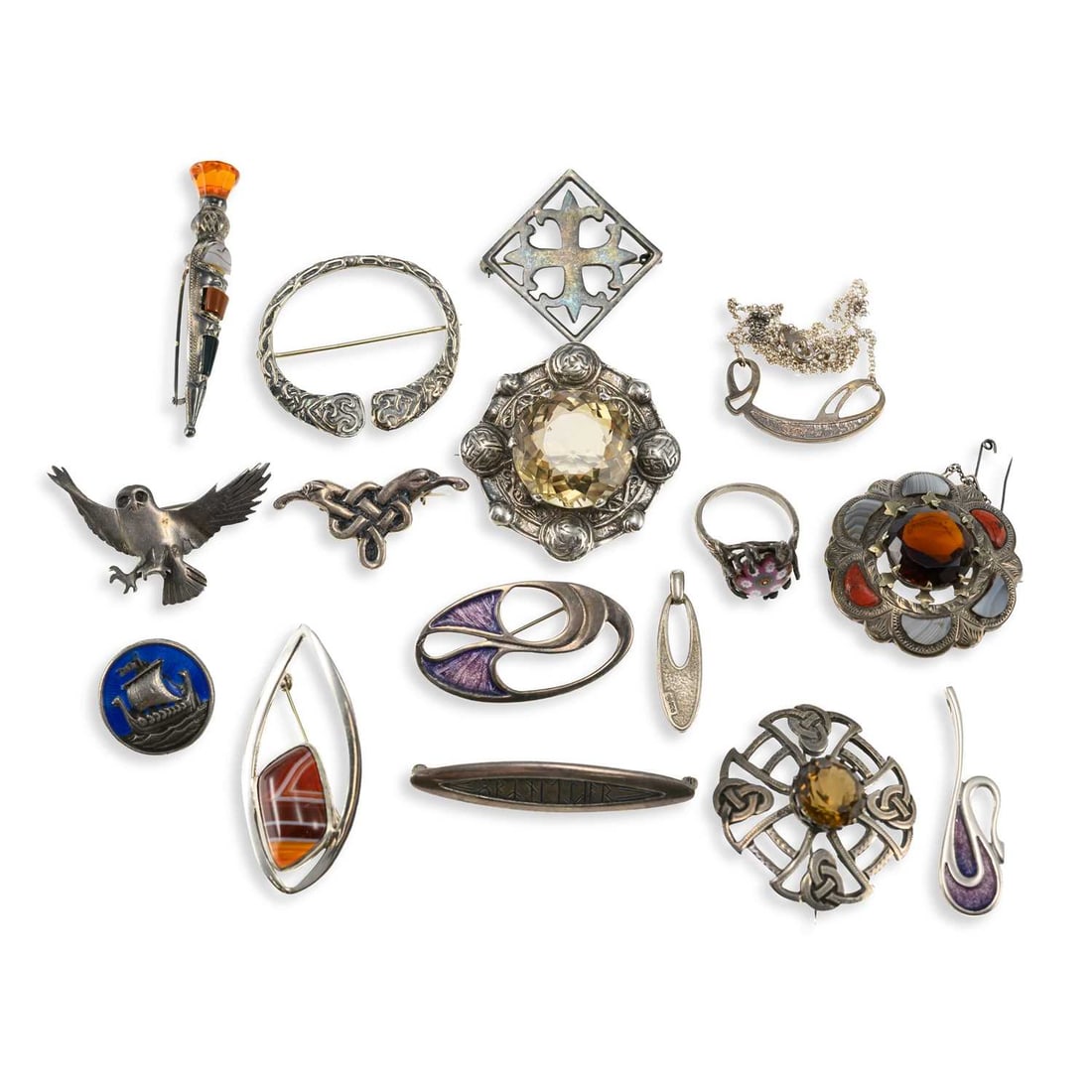 A GROUP OF SCOTTISH AND CELTIC SILVER JEWELLERY: A GROUP OF SCOTTISH AND CELTIC SILVER JEWELLERY including an IONA enamelled longship brooch; an Ola Gorie rune brooch; a Malcolm Gray silver and enamel static pendant necklace; etc. (16) First 2.2cm d